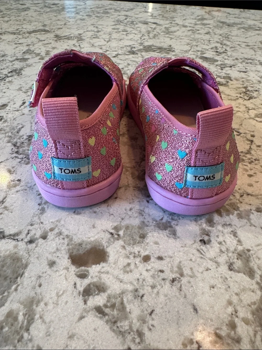 NWOT-TOMS Pink Glitter Heart Print Slip-On Sneakers. Size 11
